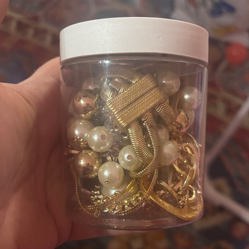 Gold and Pearl Jewelry in Clear Container